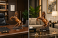 A bronze-colored rearing horse desk statue shown in two interior settings, with overlaid dimension lines indicating 25 cm width and 35 cm height. The left scene shows the statue on a wooden desk in an office-like room, and the right scene shows it on a marble table in a living room setting.


