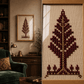 A framed needlepoint or cross-stitch tree design shown in a split view: the left side shows the finished framed artwork hanging in a cozy room with a green armchair and bookshelf, and the right side shows a close-up of the stitched canvas with a tree motif made of dark red, burgundy, and gold-toned stitched elements on a beige grid background.

