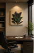 A framed wall art piece featuring three-dimensional dark green leaves mounted on a beige background, displayed in a modern home office setting above a dark wood desk with a black leather chair.

